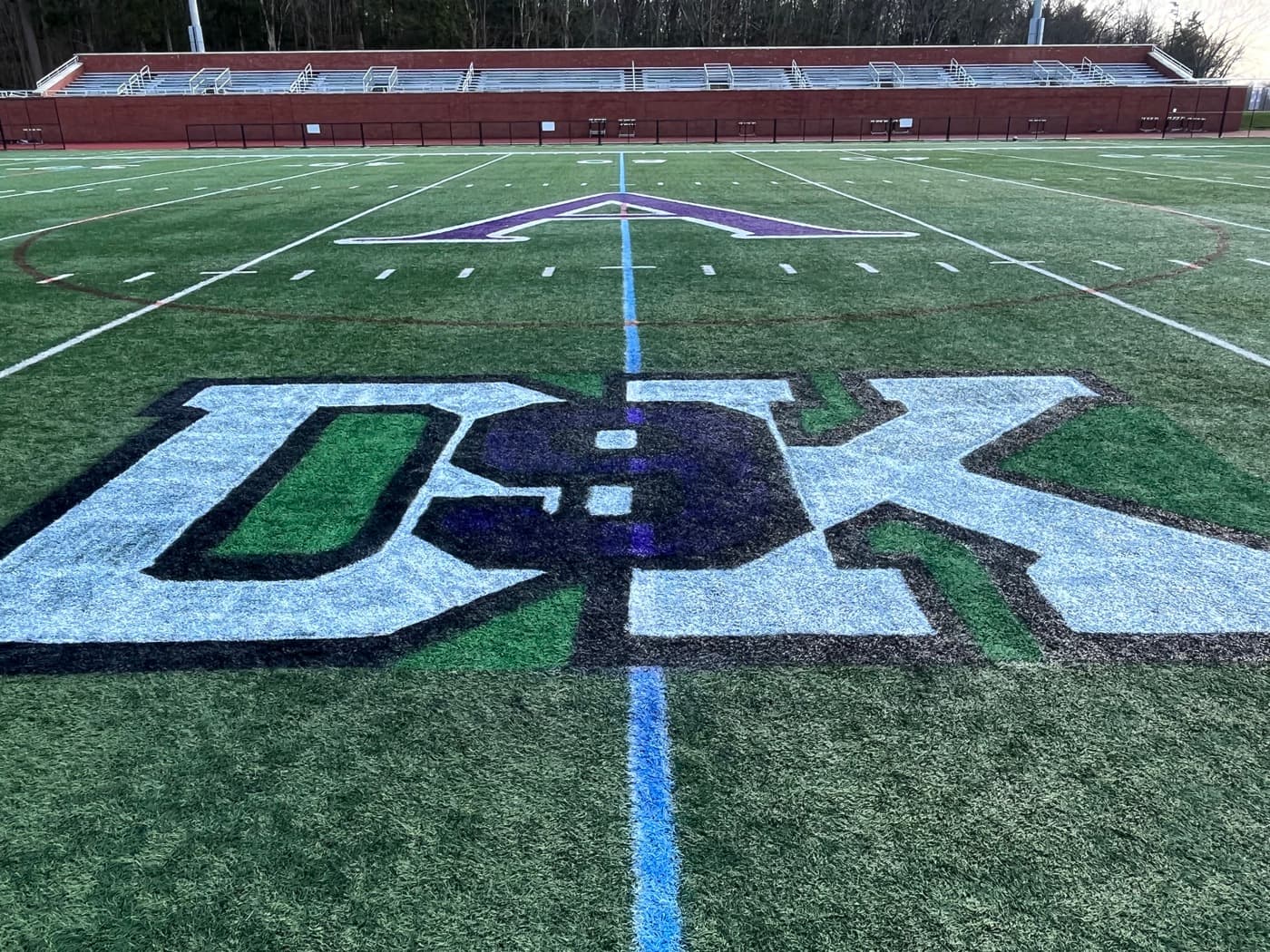 The DK logo at midfield of the Drew Kelleher memorial lacrosse field
