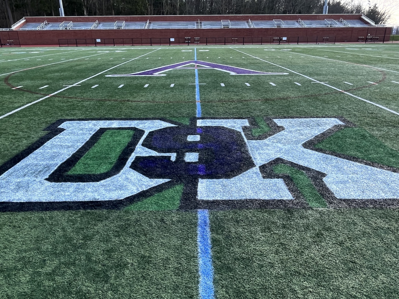 The DK logo at midfield of the Drew Kelleher memorial lacrosse field