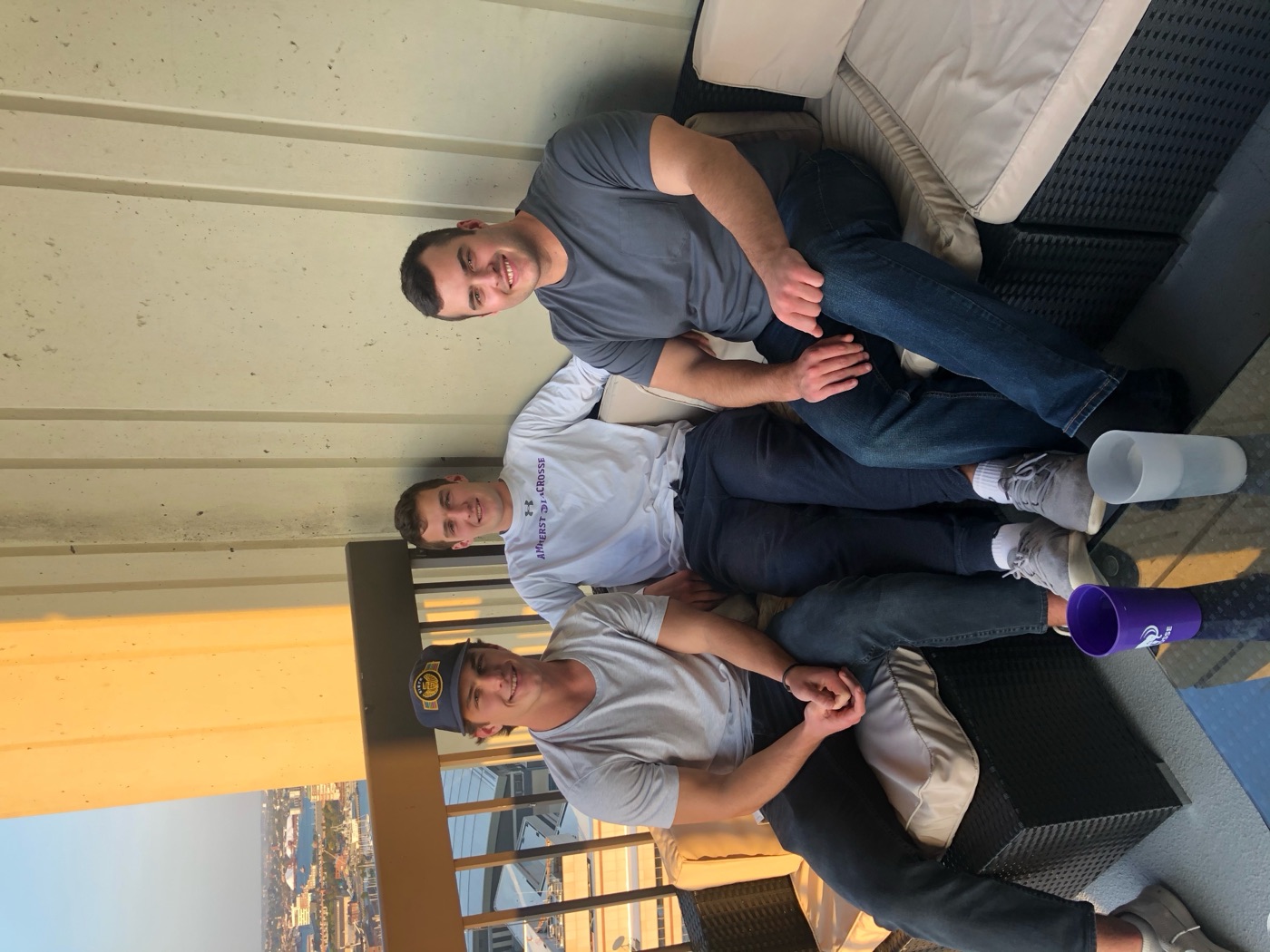 Drew with friends on a rooftop in Boston